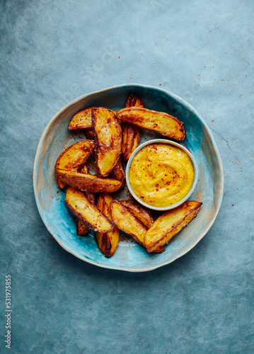 Baked spicy potatoes with yellow romesco sauce
