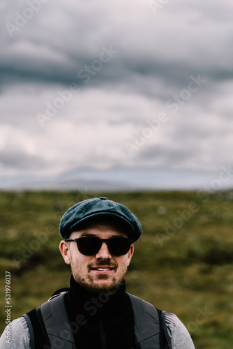 Hiker with sunglasses and baret in the Scottish Highlands. . High quality photo © Hugo