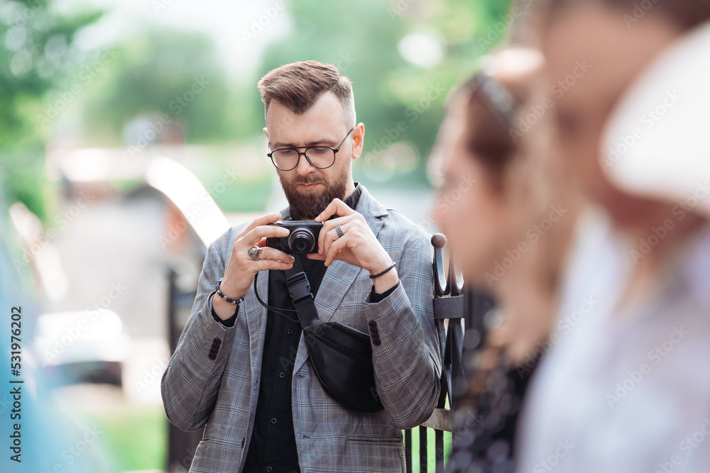 male tourist is viewing a photo on his camera. male tourist is viewing a photo on his camera.