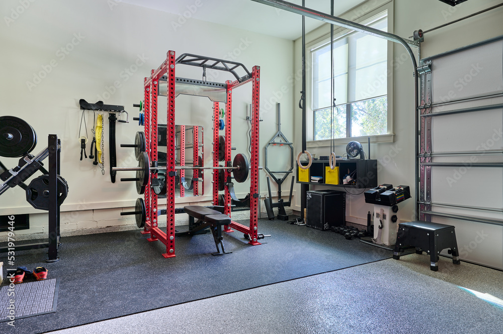 Home Gym for Weightlifting with free weights in Garage with lots of equipment Home Gym for Weightlifting with free weights in Garage with lots of equipment