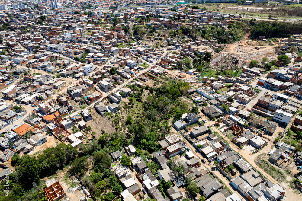 Aerial view of Parque Oziel neighborhood (also known as Jardim Monte Cristo) in Campinas, São Paulo. Poor community with wooden houses, garbage and vegetation in its surroundings.