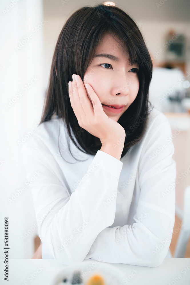 Portrait of Young beautiful asian woman in the coffee shop Portrait of Young beautiful asian woman in the coffee shop