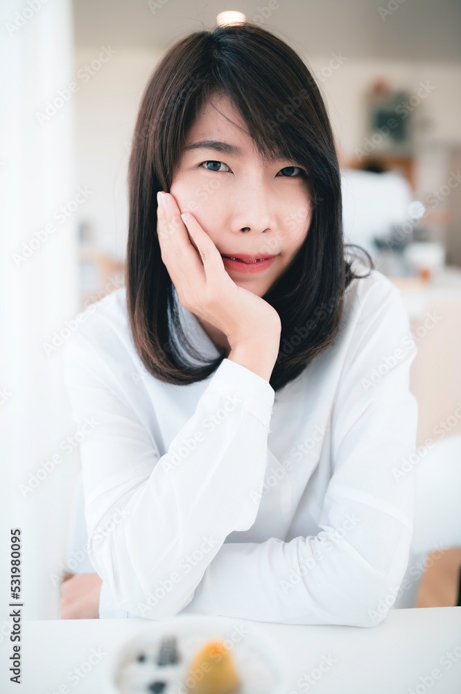 Portrait of Young beautiful asian woman in the coffee shop Portrait of Young beautiful asian woman in the coffee shop