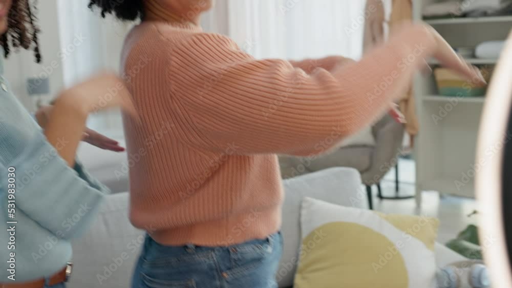 Phone dance, social media live streaming and friends happy in the living room, video for internet with mobile app and smile for online dancer challenge. Influencer dancing for fun on web in house Phone dance, social media live streaming and friends happy in the living room, video for internet with mobile app and smile for online dancer challenge. Influencer dancing for fun on web in house