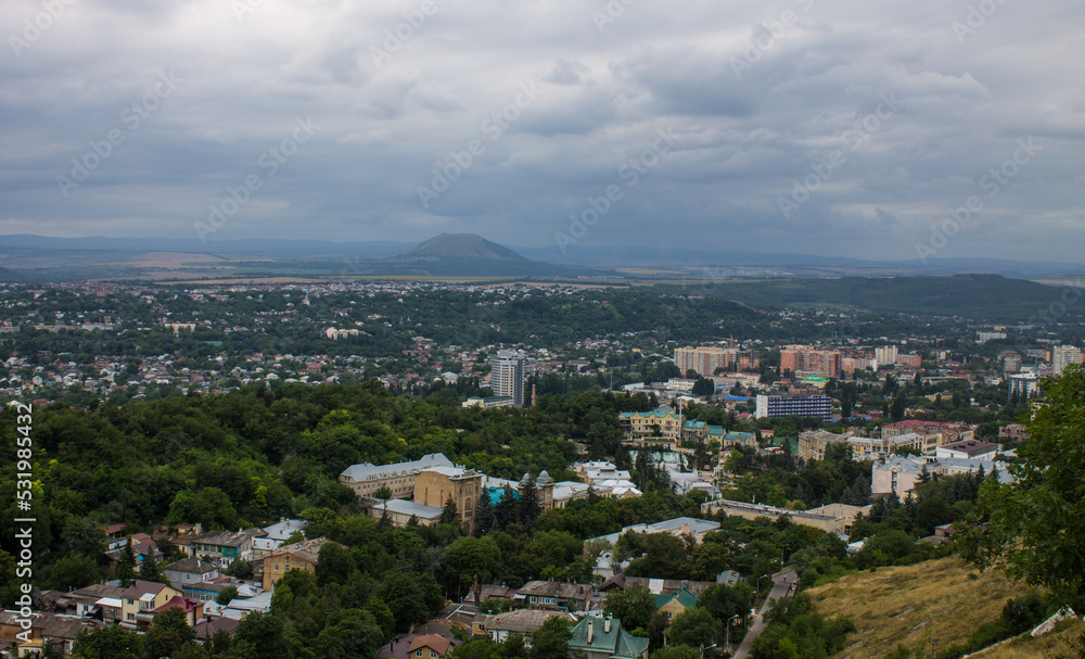 Fototapeta premium Panoramic top view of Pyatigorsk, Stavropol territory with residential buildings among green trees
