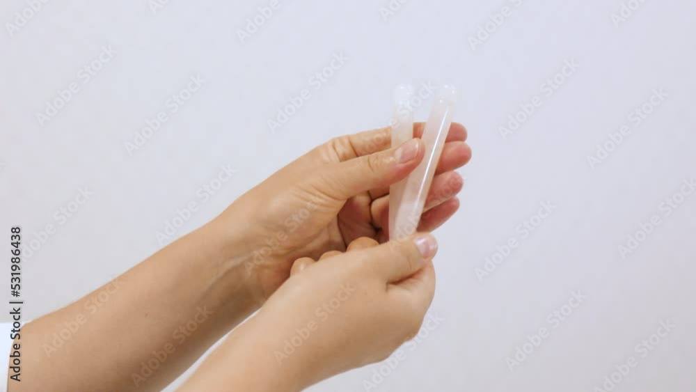 Gua sha tool in woman hands. Beauty and skincare concept. Massage for facial lifting Gua sha tool in woman hands. Beauty and skincare concept. Massage for facial lifting