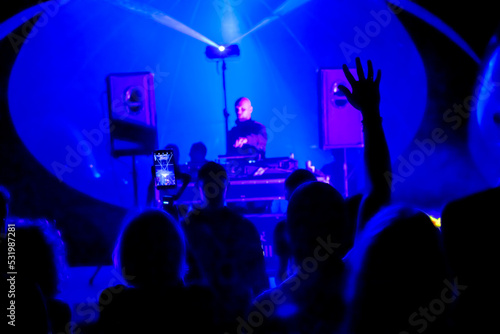 Male DJ mixing music in nightclub