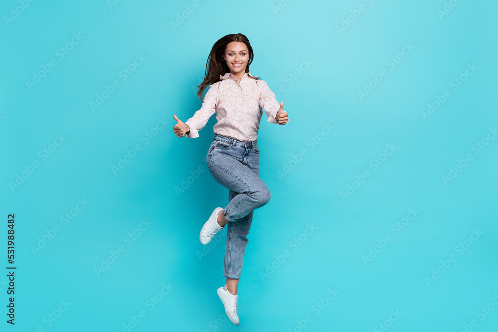 Photo of satisfied girl two arm demonstrate like cool symbol rejoice stylish outfit empty space isolated on aquamarine color background Photo of satisfied girl two arm demonstrate like cool symbol rejoice stylish outfit empty space isolated on aquamarine color background