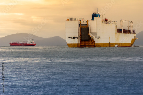 Cargo ship sails through the channel of the port of Santos