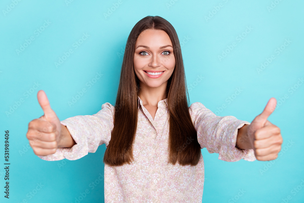 Photo of pretty cute lady raise two arm demonstrate good job nice symbol satisfied offer visit spa salon isolated on cyan color background Photo of pretty cute lady raise two arm demonstrate good job nice symbol satisfied offer visit spa salon isolated on cyan color background