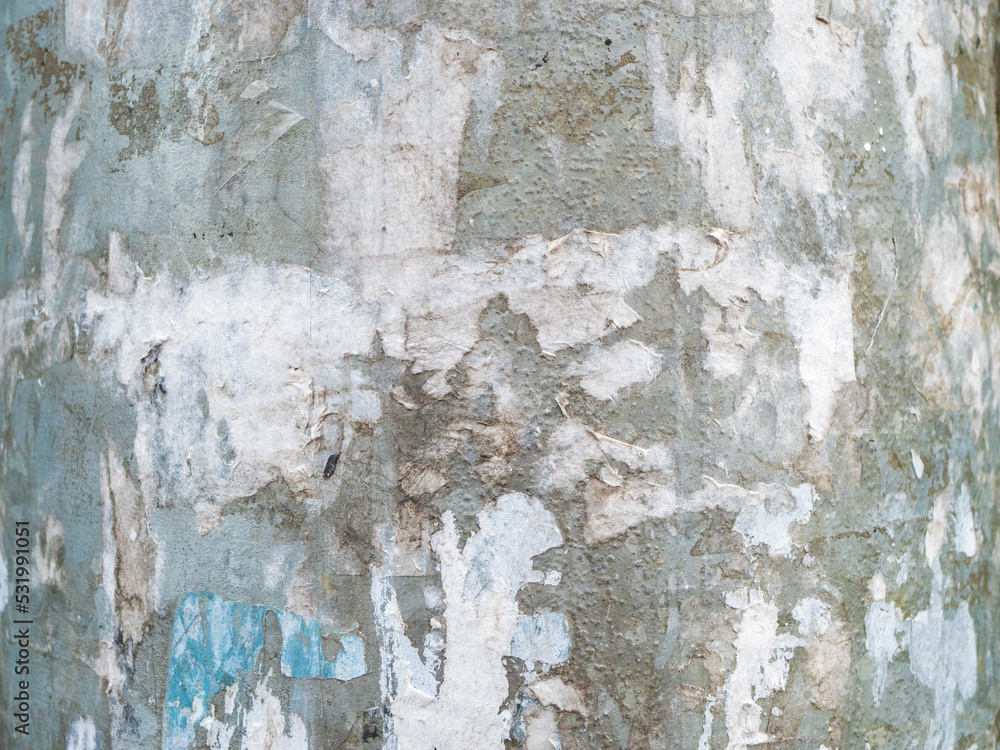 Abstract texture background. Concrete wall with old torn street posters. Design element