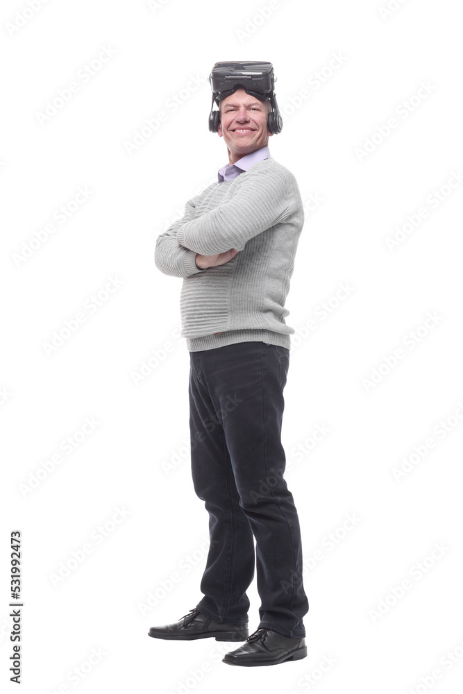 in full growth. smiling man in virtual reality glasses. in full growth. smiling man in virtual reality glasses.