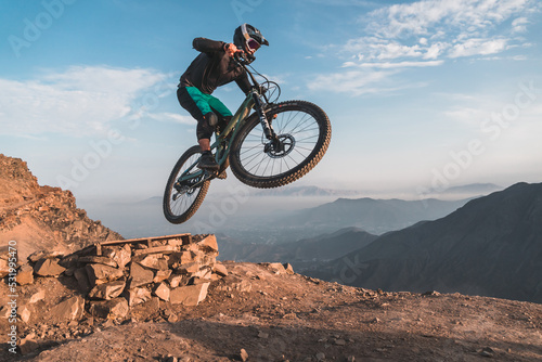 person riding a bike in the mountains