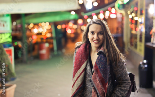 portrait of young woman in the street at night