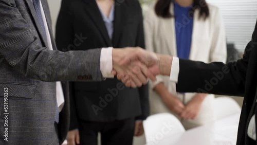 Wallpaper Mural closeup with cropped shot two businesspeople having handshake with both hands after negotiation. agreement and partnership concept Torontodigital.ca
