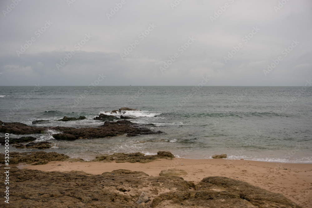 Peaceful beach scene with rocks