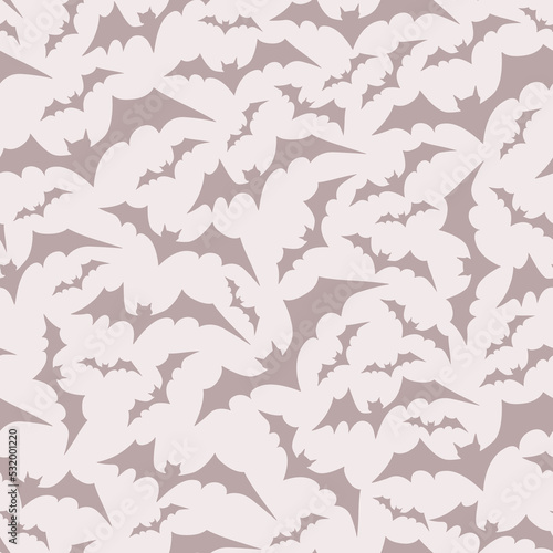 Bats vector on a nude color background, powder pink, monochrome, cartoon character. Seamless pattern. Halloween symbol circling flying bats. The illustration is hand drawn.