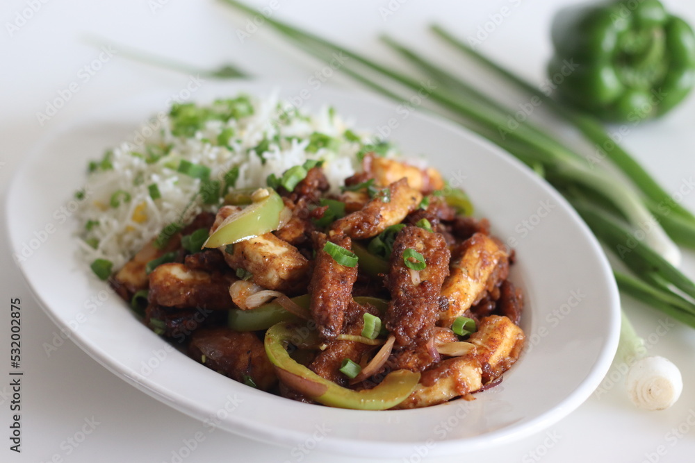 Panner Baby corn Manchurian. A crispy and crunchy Indo Chinese vegetarian dish, in a smooth gravy with stir fried capsicum and onions