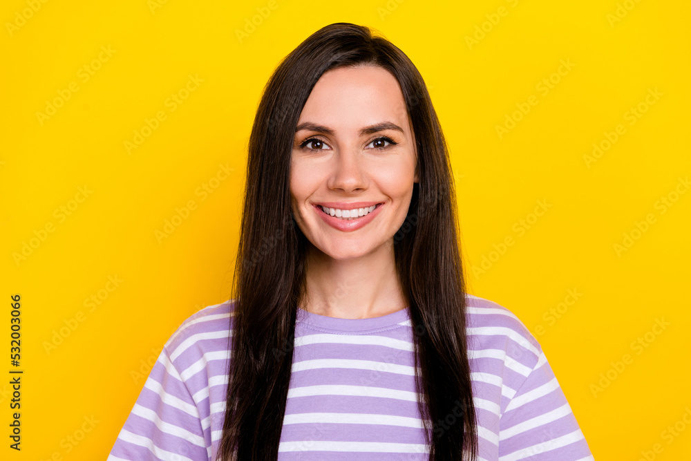 Photo of nice gorgeous cheerful positive girl with straight hairstyle dressed striped t-shirt smiling isolated on yellow color background Photo of nice gorgeous cheerful positive girl with straight hairstyle dressed striped t-shirt smiling isolated on yellow color background