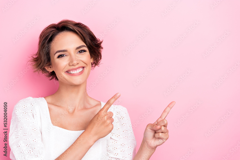 Photo portrait of pretty young lady direct empty space skincare product promo wear stylish white clothes isolated on pink color background Photo portrait of pretty young lady direct empty space skincare product promo wear stylish white clothes isolated on pink color background