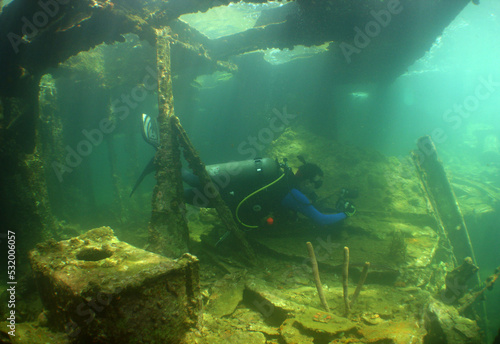 underwater scene , scuba diver , ship wreck , caribbean sea