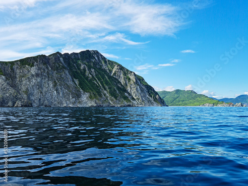 Russia, Kuril Islands, Sakhalin region. The nature of the Kamchatka Territory. Mountains and volcanoes surrounded by the Sea of Okhotsk and the ocean
