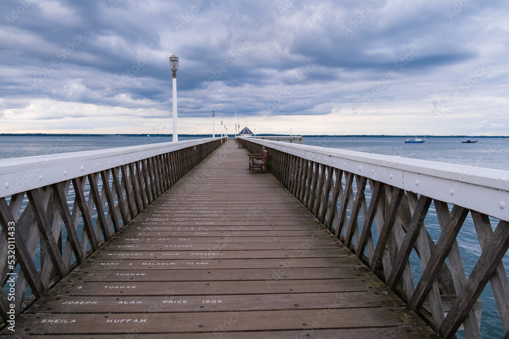 Wooden pier over the sea with no one on it Wooden pier over the sea with no one on it