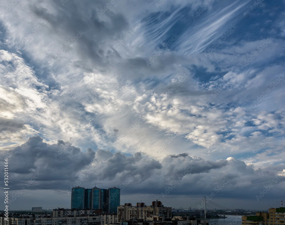 Unusually beautiful clouds over the evening city Unusually beautiful clouds over the evening city