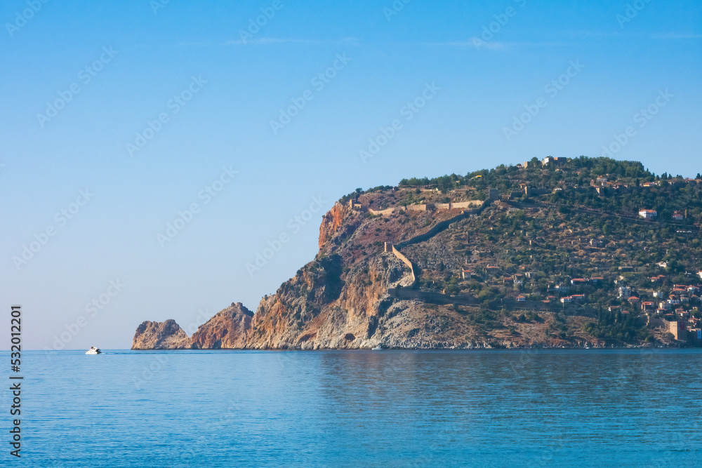 Fragment of the Alanya Peninsula with old city fortress, on a sunny day