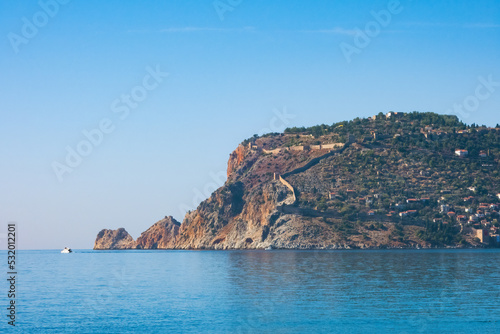 Fragment of the Alanya Peninsula with old city fortress, on a sunny day © RISHAD