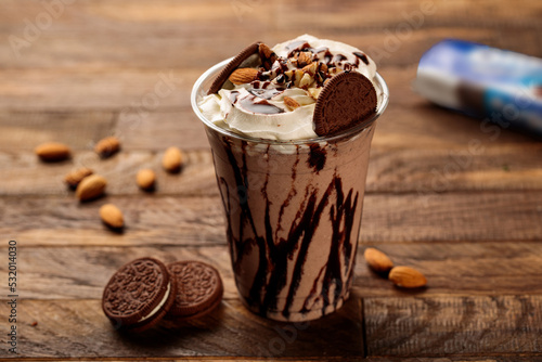 Εκτύπωση καμβά Oreo milkshake with oreo biscuits, almond served in glass side view on wooden ta