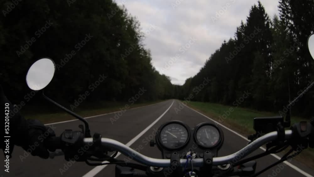 riding a motorcycle from the point of view of a motorcyclist, riding a winding forest road. Noise in video. riding a motorcycle from the point of view of a motorcyclist, riding a winding forest road. Noise in video.