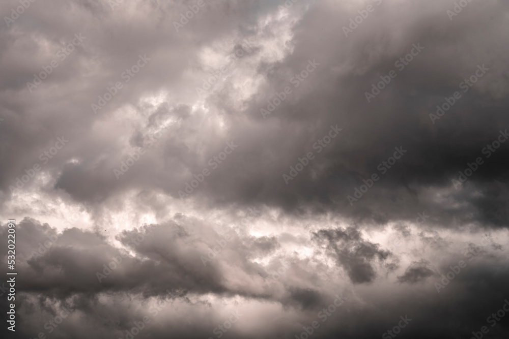 Dark background of storm clouds. Dramatic dark cloudy sky over the sea, natural background photo Dark background of storm clouds. Dramatic dark cloudy sky over the sea, natural background photo