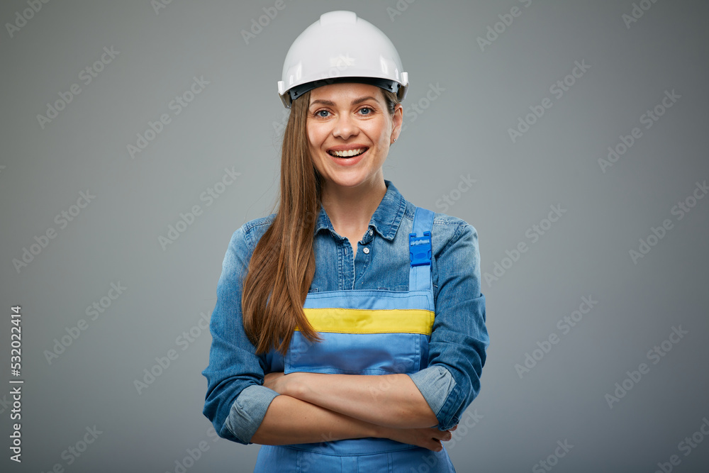 Woman architect or engineer in safety industrial helmet standing with arms crossed. Isolated female portrait. Woman architect or engineer in safety industrial helmet standing with arms crossed. Isolated female portrait.