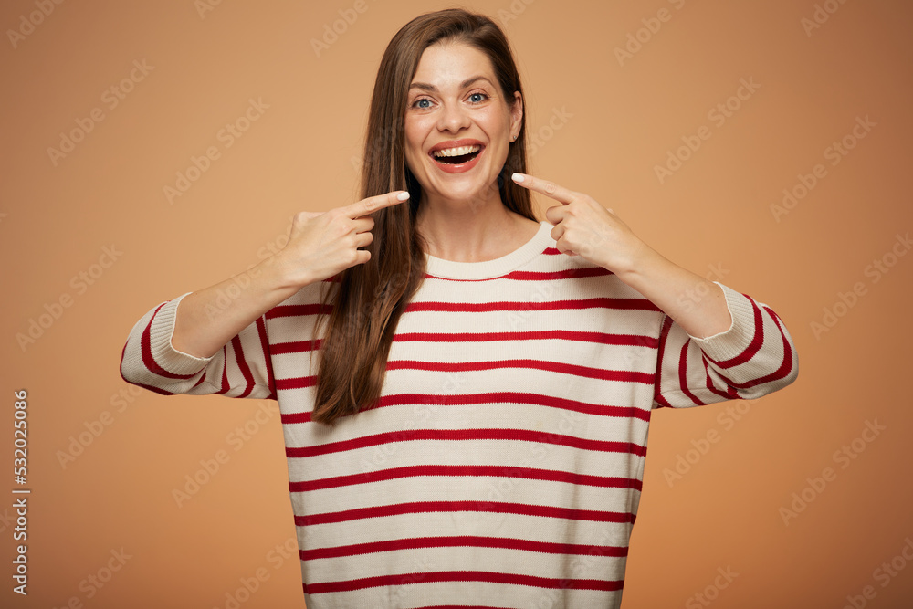 Woman with toothy smile pointing with fingers. Isolated female portrait. Woman with toothy smile pointing with fingers. Isolated female portrait.