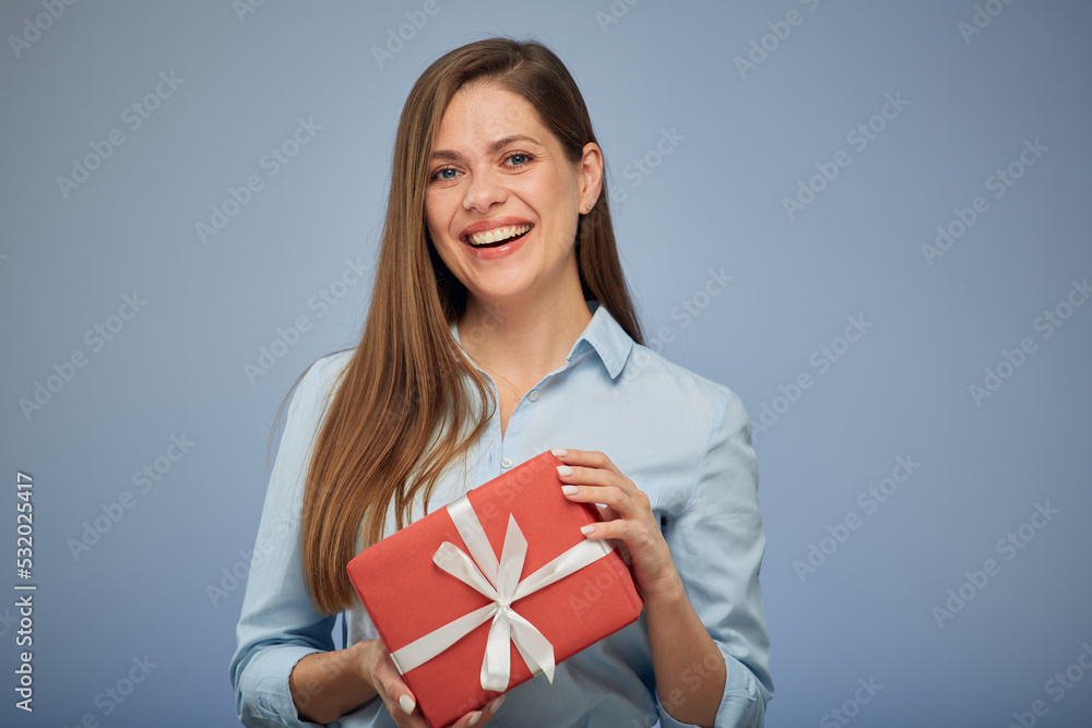Happy woman holding gift box. Isolated female portrait. Happy woman holding gift box. Isolated female portrait.