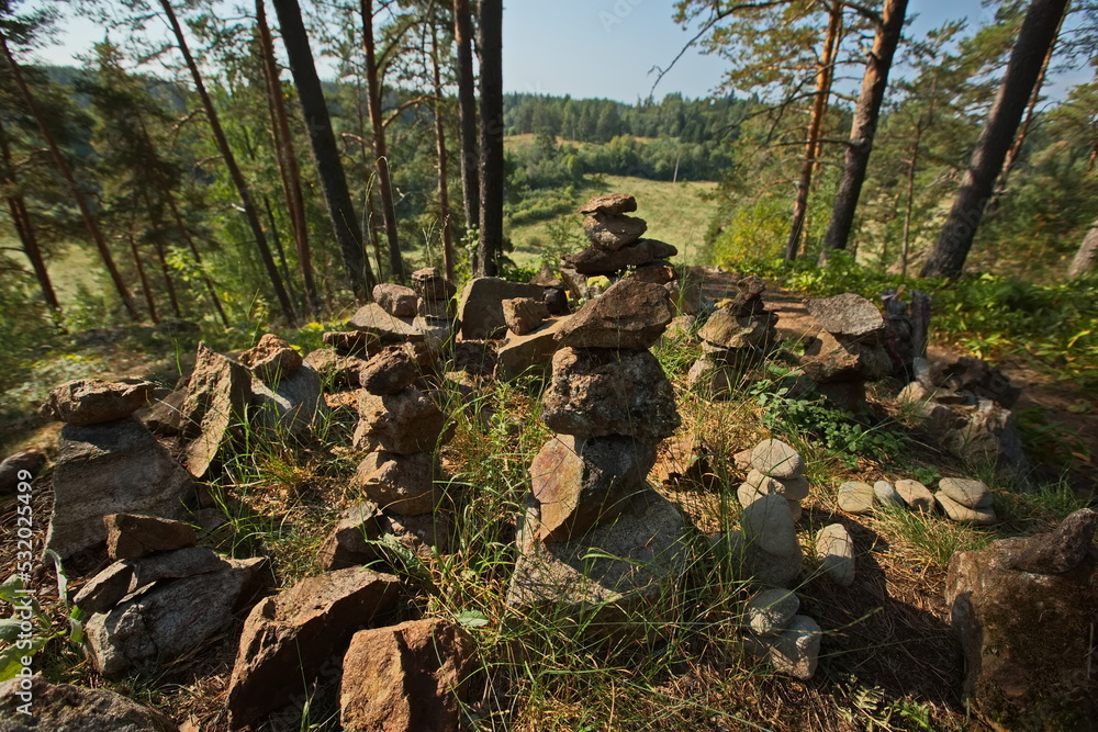 Stone pyramids laid out by tourists in the Karelian forest. Stone pyramids laid out by tourists in the Karelian forest.