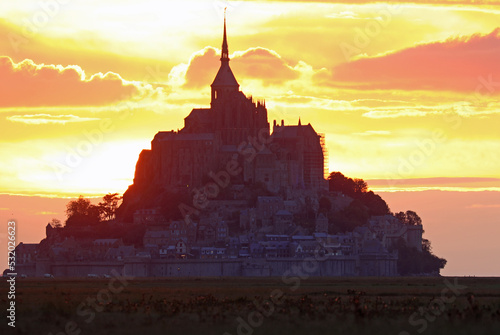 Silhouette of the abbey of Mont Saint michel in Normandy in the North of France at sunset
