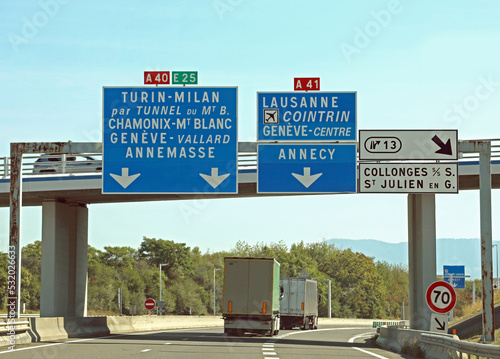 road sign with directions to go to French places photo