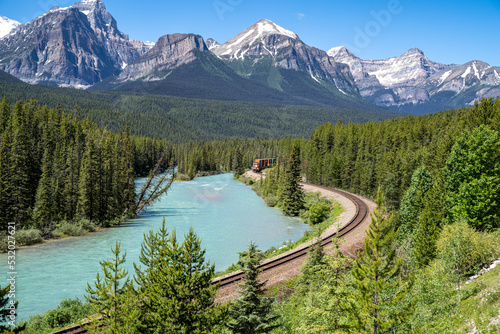 Train approaches on Morant's Curve, a famous viewpoint in Banff National Park along the Bow Valley Parkway in summer © MelissaMN