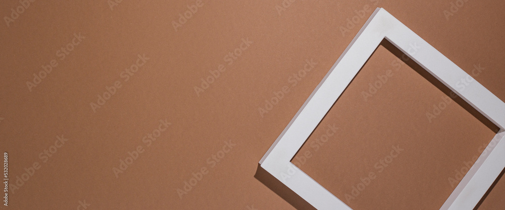 Podium for presentation square white frame on brown background. Top view, flat lay. Banner Podium for presentation square white frame on brown background. Top view, flat lay. Banner