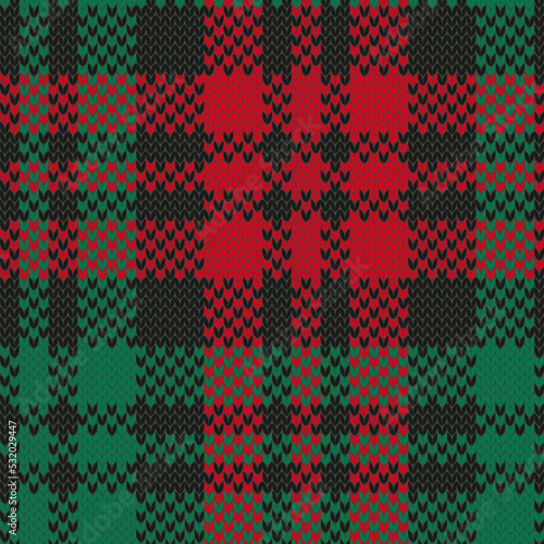 Christmas jacquard knitted seamless pattern. Plaid checkered red and green. Colorful vector illustration.