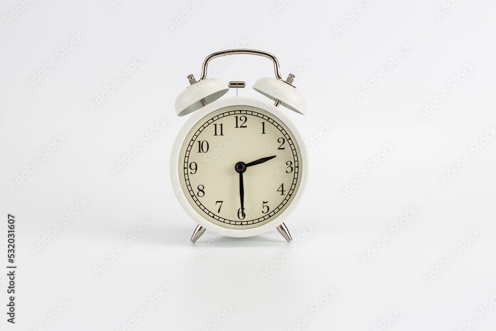 White retro clock alarm clock on white background shows 02:30 am or 02:30 pm or 14:30 White retro clock alarm clock on white background shows 02:30 am or 02:30 pm or 14:30