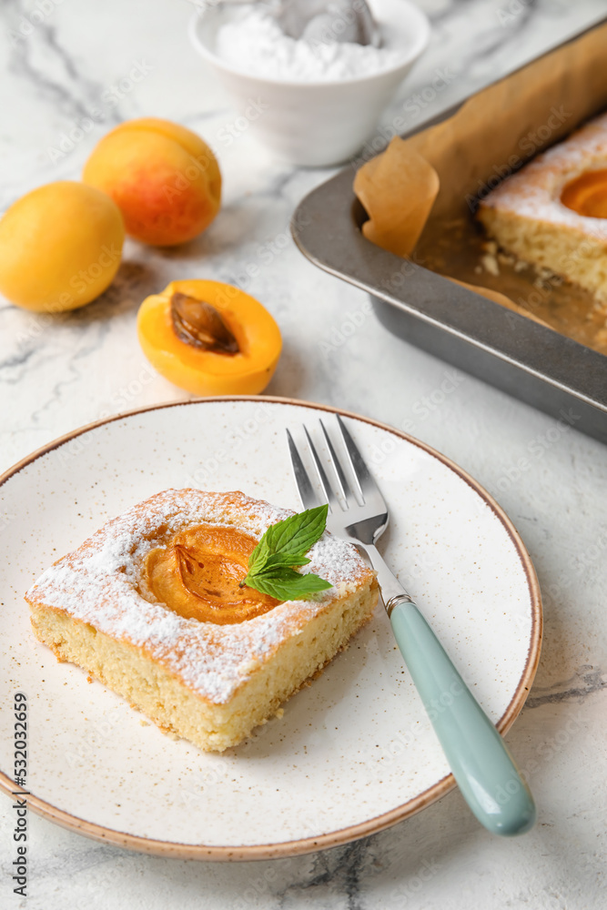 Plate with delicious apricot pie on light background, closeup Plate with delicious apricot pie on light background, closeup