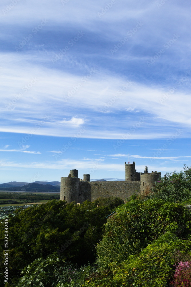 Harlech Castle, Wales. Landscape view of a historic UNESCO monument.   Beautiful Welsh world heritage site.  Fortification of Edward 1 of England.  Blue sky and copy space.