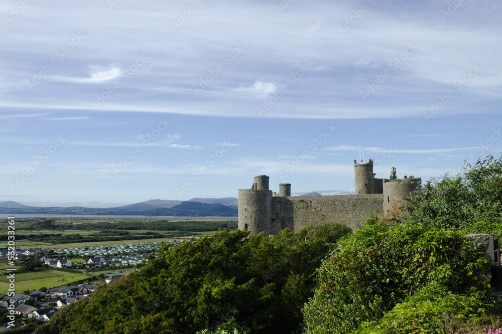 Harlech Castle, Wales. Landscape view of a UNESCO monument.   Beautiful Welsh world heritage site.  Fortification of Edward 1 of England.  Blue sky and copy space.