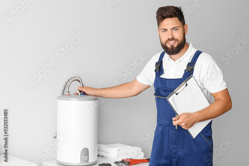 Male plumber with clipboard...