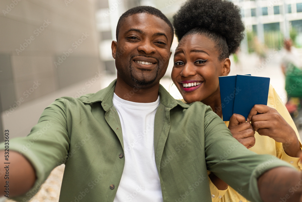 Happy Black Spouses Making Selife Showing Passports Posing At Airport