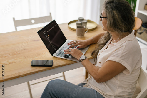 Mature female working from home on the computer