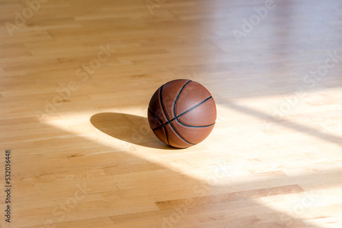 iBasketball court wooden floor with professional brown leather ball and shadows. Horizontal sport poster, greeting cards, headers, website © Augustas Cetkauskas